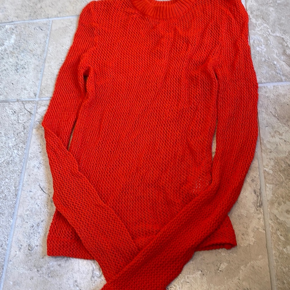 Crochet sweater in vibrant red-orange